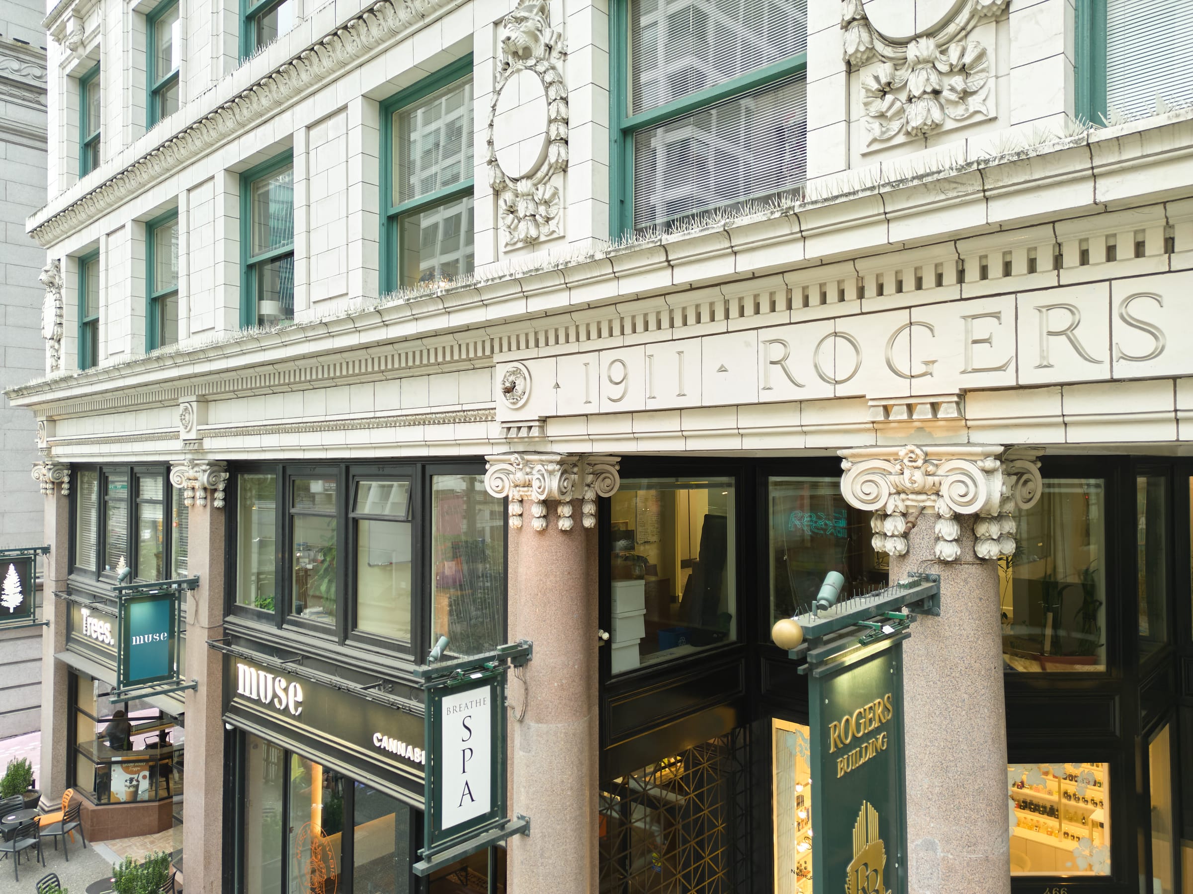 Street level view of the Rogers Building's granite columns and shopfronts