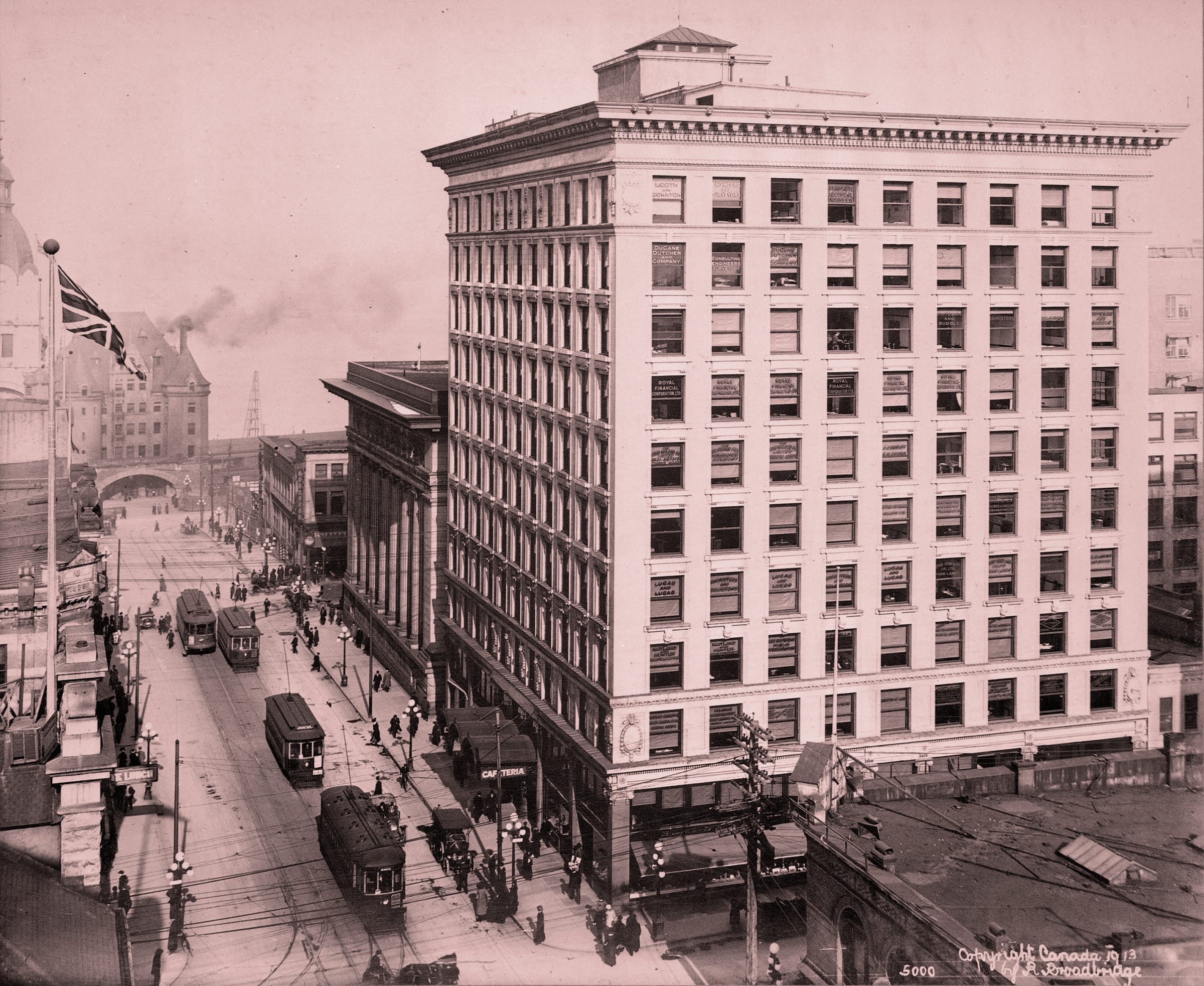 The Rogers Building in 1913 rising above Granville Street streetcars