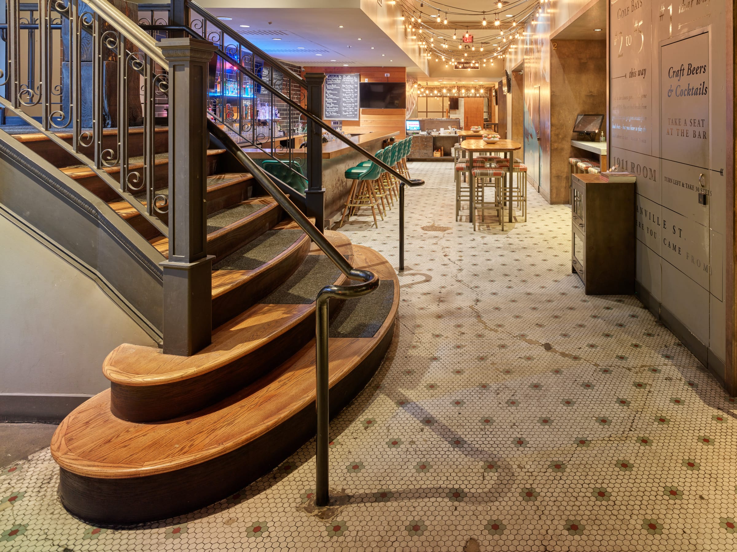 The basement level of the Rogers Building today, with its curved stair and original mosaic floor