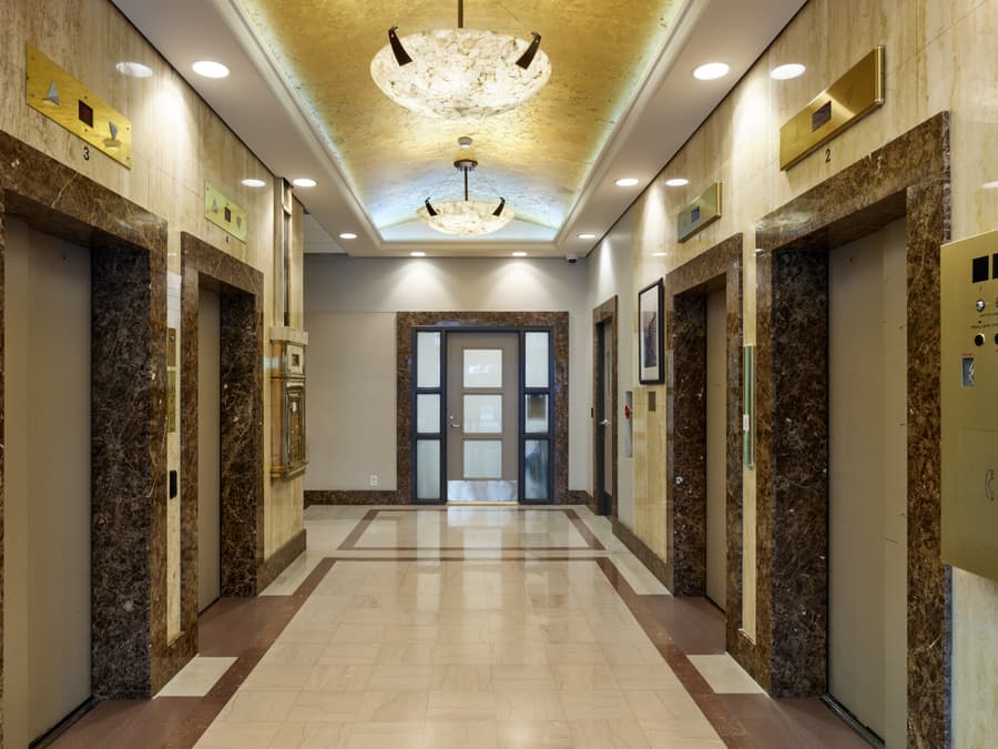 Elevator lobby of the Rogers Building with gold-leaf ceiling and alabaster pendant lights