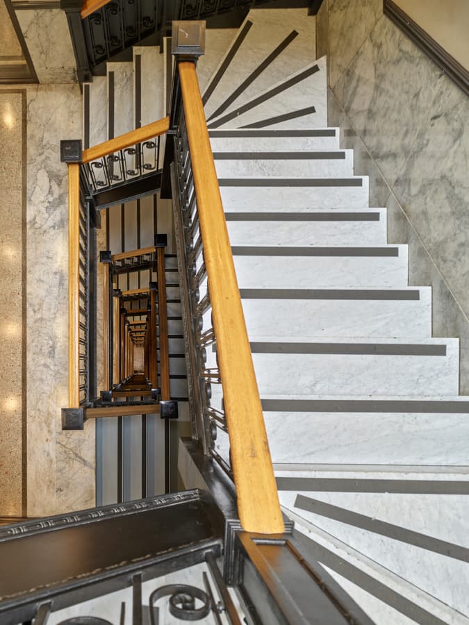 Looking down the original marble stairwell of the Rogers Building